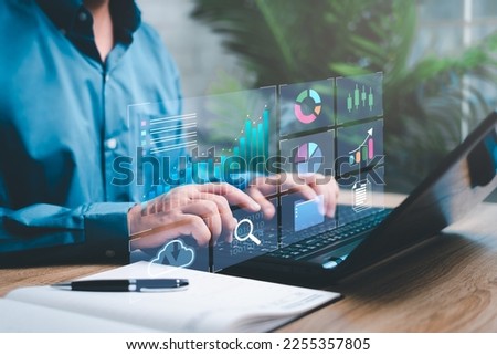 Smart digital marketing data management concept, Businessman use the laptop to work marketing analysis chart strategic planning for sustainable development and financial and investment competition