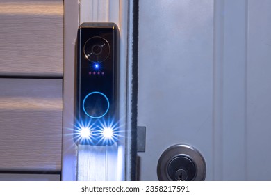 A Smart doorbell at night with smart AI package detection as well as facial recognition and human detection. Dual cameras technology also has delivery guard and motion-activated event recording.