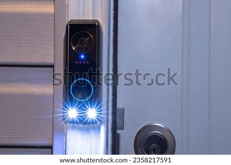 A Smart doorbell at night with smart AI package detection as well as facial recognition and human detection. Dual cameras technology also has delivery guard and motion-activated event recording.