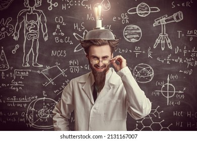 A smart eccentric scientist stands at the blackboard with scientific formulas and diagrams with a strange invention on his head and laughs madly. Science and new inventions.