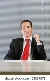 Smart Eurasian Business Man In Formal Attire Working And Browsing With Documents