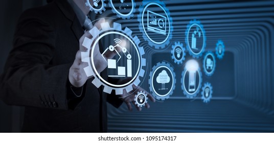 Smart factory and industry 4.0 and connected production robots exchanging data with internet of things (IoT) with cloud computing technology.business man with an open hand as showing something concept
