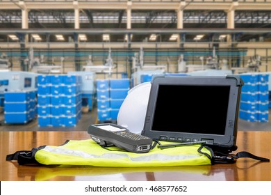 Smart Factory - Rugged Computers Tablet And Bluetooth Barcode Scanner In Front Of Modern Warehouse In Factory Use For Logistics.