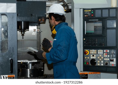 Smart factory worker or engineer do machine job in manufacturing workshop . Industry and engineering concept .