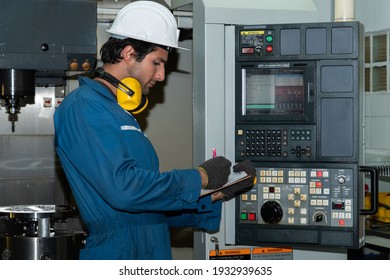Smart factory worker or engineer do machine job in manufacturing workshop . Industry and engineering concept .