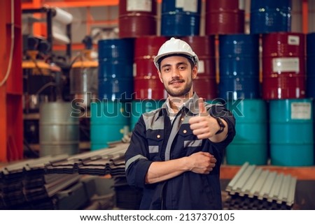 Smart factory worker engineering manager working at industrial worksite , wearing hard hat for safety