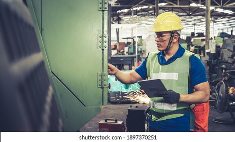 Smart factory worker using machine in factory workshop . Industry and engineering concept.