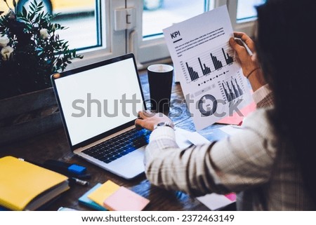 Similar – Image, Stock Photo Anonymous woman checking charts on screen of laptop in modern office