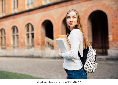 smart female college student on campus outdoors