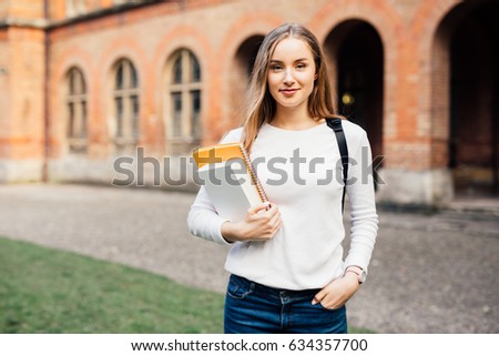 smart female college student on campus outdoors