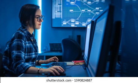 Smart Female IT Engineer / Programer Working on Desktop Comuter. Software Development / Coding/ Web Design / Database Architecture. Young Girl STEM Graduate Working