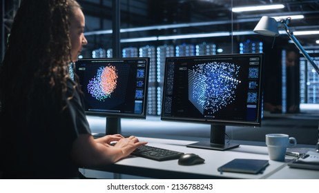 Smart Female IT Programer Working On Desktop Green Mock-up Screen Computer In Data Center System Control Room. Professional Programming Sophisticated Code In A High Tech Development Laboratory.