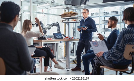 Smart Female Student Ask her Mentor a Question. Young Promising Computer Specialists Teamwork. Robotics and Future Progressive Researchers. Innovative Startup Company Concept. - Powered by Shutterstock