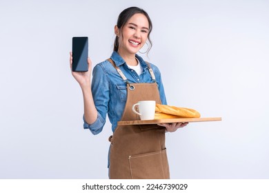 smart friendly asian female glasses barista small coffee shop owner in apron hand gesture welcome customer come and enjoy his coffee drink,happy girl show smartphone online order is ready for you - Shutterstock ID 2246739029