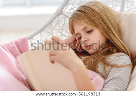 Similar – Image, Stock Photo Blond, interested, curious child in a blue striped shirt, at home in front of a bright window with light, looks into the camera. Gobble-eyed, sweet tooth watches, spellbound, expectant the family. Dreamy toddler dreams daydream