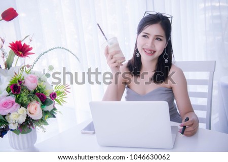 Smart girl's using laptop and happy time on work , smile and laughing time work , workingwomen get think about work
