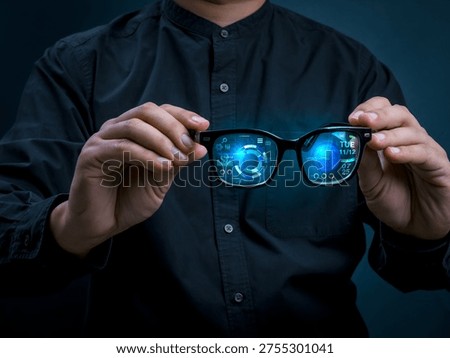 Smart glasses with augmented reality interface displaying digital data and futuristic UI dashboard in businessman hands. Wearable technology, real-time analytics, next-generation digital experience.