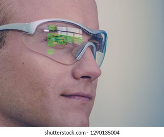 Smart Glasses Futuristic Technology Concept, Man Wear Smart Glasses With Augmented Reality To Managing Field Service And Assembly, In Warehouse As Addition To Voice, Navigation And Map In Industry 4.0