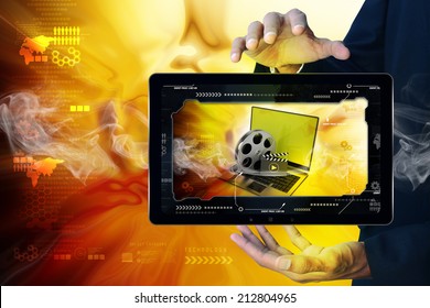 Smart hand showing Laptop with reel in frame