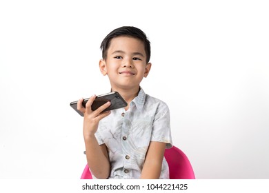 smart and handsome boy using a smartphone on isolated white background.