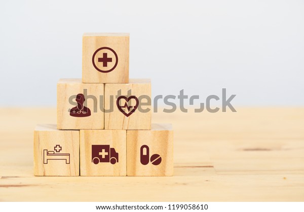 smart health care, insurance concept, wooden cube\
symbolize insurance to protect or cover person, Property\
,Liability, reliability,car, life, business, health, house, legal\
expenses, travel