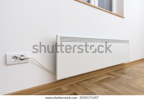 Smart heater convector.\
Smart Home with the smart heating system. Electric panel heating\
concept.