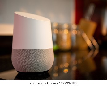 Smart home assistant speaker on kitchen worktop in home setting