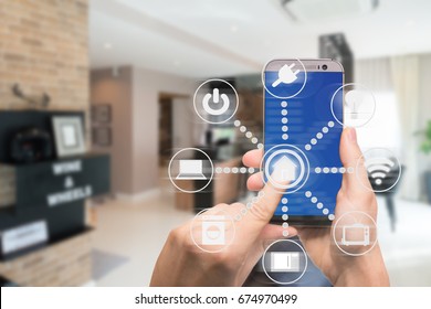 Smart home automation app on mobile with home interior in background. Internet of things concept at home. Smart technology 4.0