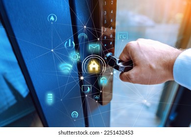 Smart home concept. Male hand holding a handle of key free smart lock. Keyless access to home. Smart home automation concept with futuristic icons on top of the photo.