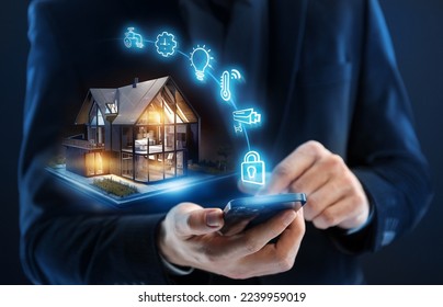 Smart home concept. Remote control and home management - Shutterstock ID 2239959019