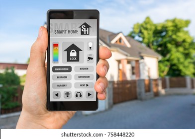 Smart Home Control App On Smartphone With Unfocused Home In Background