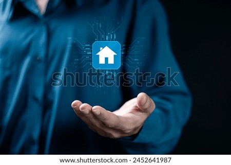 Smart home control concept. remote home control online home automation system. Businessman holding smart home technology on virtual screen.