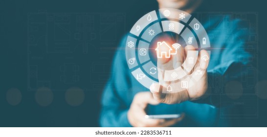 Smart home control interface with finger-touching home automation button on virtual screen dashboard. Wireless connection between smart devices, Internet of Things technology, security and Systems IOT