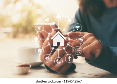 Smart Home Control With Smartphone,Lifestyle Of Person In Modern Life Internet Of Things, Smart House Technology.The New Innovation Of The Future.