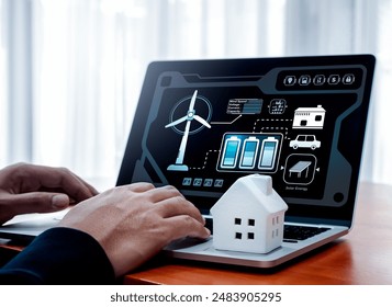 Smart home, power your home with renewable energy concept. Renewable energy data system and management control display and white small house on laptop computer while person monitor on screen at home. - Powered by Shutterstock