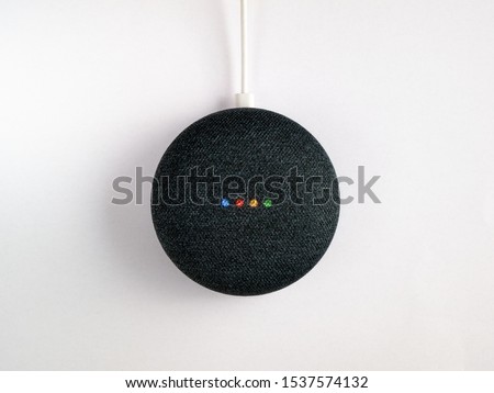 smart home speaker device voice activated illuminated on white background