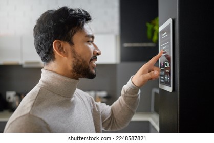 Smart home technology, wall system and man with digital ui monitor for thermostat heating, safety security network or air conditioning. AI software app, house automation or profile of person with IOT - Shutterstock ID 2248587821