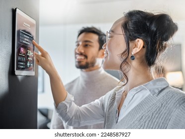 Smart home technology, wall system and couple with digital dashboard for air conditioning, safety security network or house automation. App software, ui panel and Asian people programming IOT monitor - Shutterstock ID 2248587927