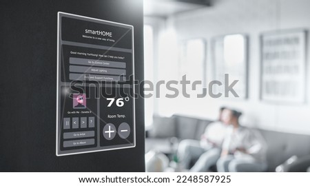 Smart home technology, wall system and digital dashboard monitor for house automation, air conditioning or safety security network. IOT app software, ui music panel and couple relax on apartment sofa