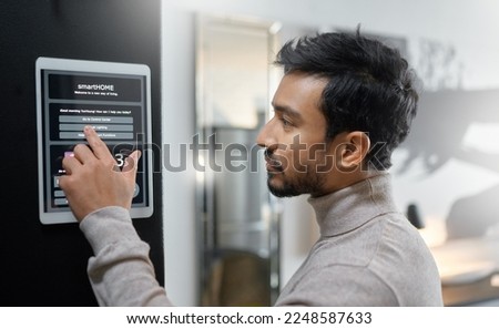 Smart home wall system, technology and man with digital screen interface for room lighting, house automation or air conditioning. AI software app, control panel and profile of person with IOT monitor