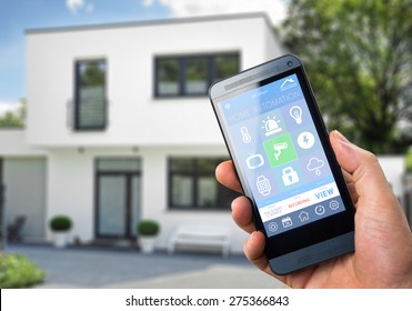 smart house, home automation, device with app icons. Man uses his smart phone with smarthome security app to unlock the door of his house.