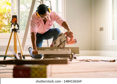 Smart Indian Contractor Hand Use Sawing Machine Wood Work House Renovation Background Home Improvement Ideas Concept