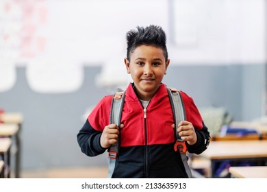 A smart Indian pupil on a class with schoolbag. - Powered by Shutterstock