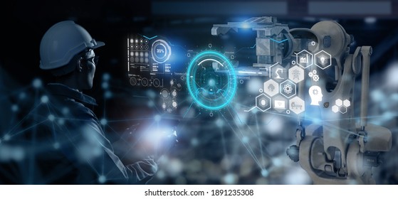 smart industry 4.0 futuristic technology concept, engineer use artificial intelligence combine  augmented mixed virtual reality display, digital twin with 5g to control robot arm in smart factory  - Powered by Shutterstock