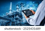 Smart industry 4.0 mangement control system concept.Hands holding tablet on blurred Chemical plant refinery industrial equipment as background