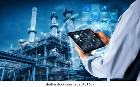 Smart industry 4.0 mangement control system concept.Hands holding tablet on blurred Chemical plant refinery industrial equipment as background - Powered by Shutterstock