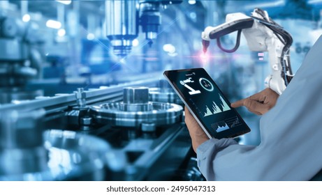 Smart industry automation manufacturing control concept.Hands holding tablet on blurred automation machine as background	
 - Powered by Shutterstock