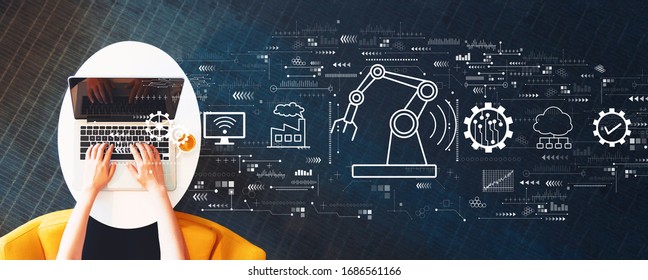 Smart industry concept with person using a laptop on a white table - Shutterstock ID 1686561166