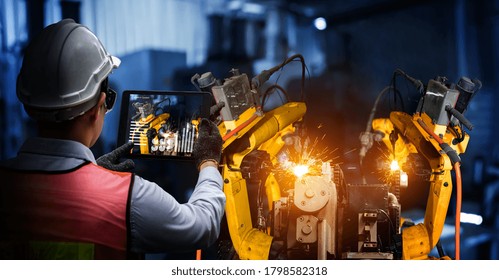 Smart Industry Robot Arms For Digital Factory Production Technology Showing Automation Manufacturing Process Of The Industry 4.0 Or 4th Industrial Revolution And IOT Software To Control Operation .