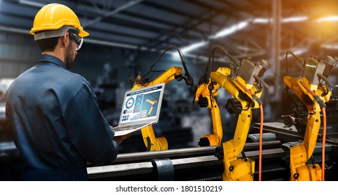 Smart Industry Robot Arms For Digital Factory Production Technology Showing Automation Manufacturing Process Of The Industry 4.0 Or 4th Industrial Revolution And IOT Software To Control Operation .